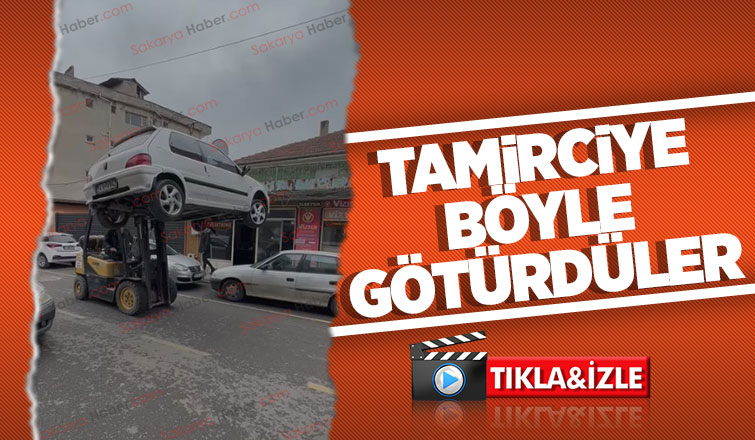 Aksı kırılan otomobili forkliftle taşıdılar