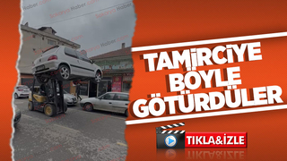 Aksı kırılan otomobili forkliftle taşıdılar