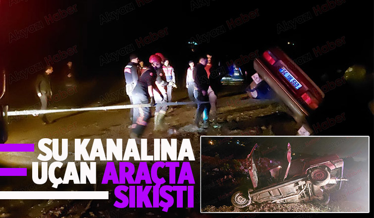 Akyazı'da kanala uçan araçta sürücü sıkıştı