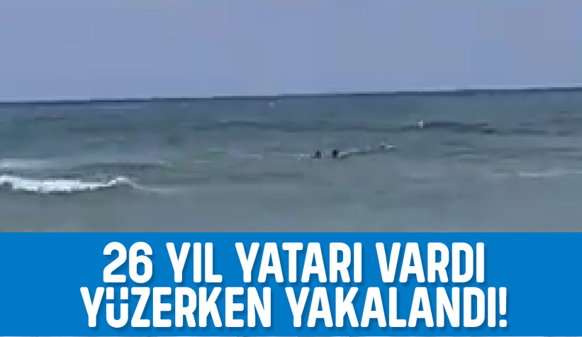 Aranan firari yüzerken yakalandı