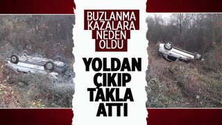 Buzlanan yolda kayıp takla attı