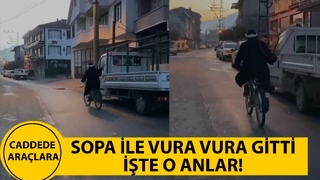 Caddede bisikleti ile araçlara vura vura böyle gitti