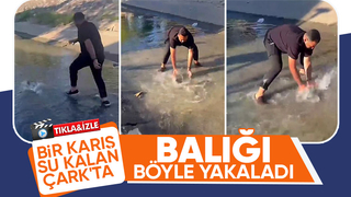 Çark Deresi'nde eliyle balık yakaladı