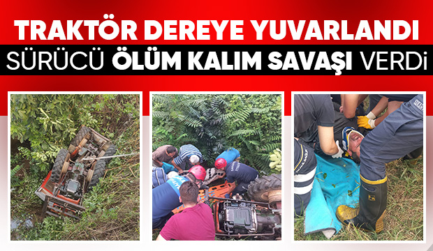 Dereye yuvarlanan traktörün altında kaldı
