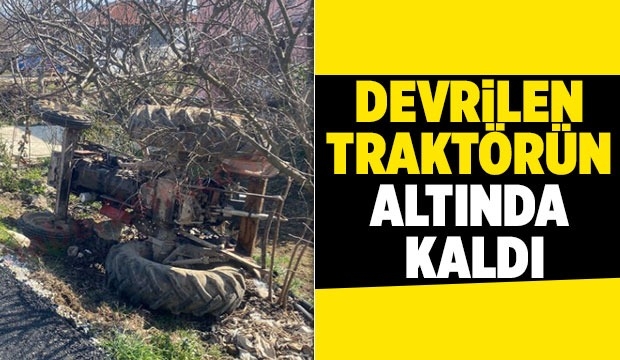 Devrilen traktörün altında kalan sürücü kurtarıldı