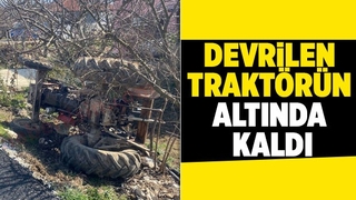 Devrilen traktörün altında kalan sürücü kurtarıldı