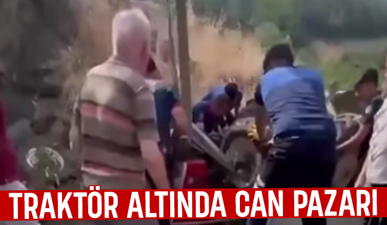 Devrilen traktörün altında kaldı