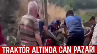 Devrilen traktörün altında kaldı