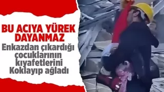 Enkazdan çıkardığı çocuklarının kıyafetlerini koklayıp sarıldı