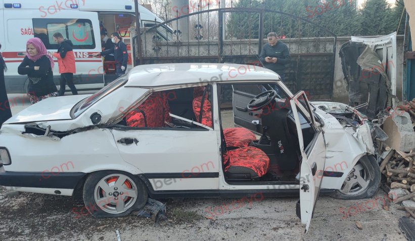 Otomobil evin bahçesine daldı: 2 yaralı