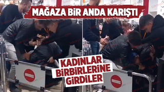 Kadınlar mağazada birbirlerine girdi