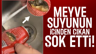 Meyve suyundan çıkan cisimle şok oldu