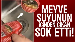 Meyve suyundan çıkan cisimle şok oldu