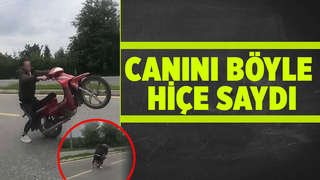 Motosikletli gencin tehlikeli oyunu kamerada