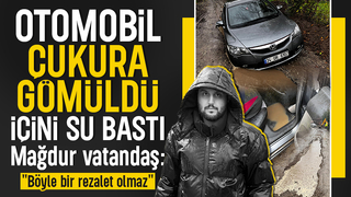 Otomobil dev çukura gömüldü