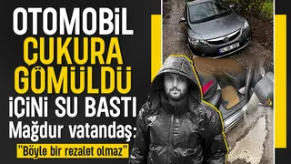 Otomobil dev çukura gömüldü