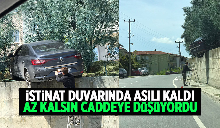 Otomobil istinat duvarında asılı kaldı