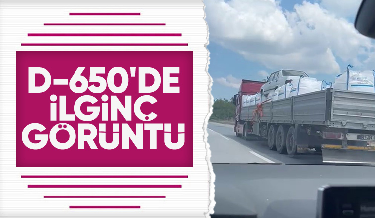 Otomobili çuvalların üzerine koyup taşıdı