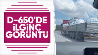 Otomobili çuvalların üzerine koyup taşıdı