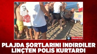 Plajda şortlarını indiren iki kişi linç ediliyordu