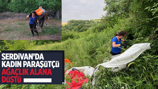 Serdivan'da kadın paraşütçü ağaçlık alana çakıldı