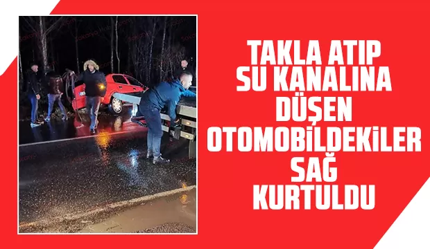 Su kanalına takla atan otomobildekiler yara almadı
