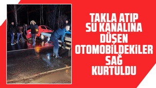 Su kanalına takla atan otomobildekiler yara almadı