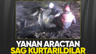 Takla atıp yanan araçtaki 2 kişi ölümden döndü