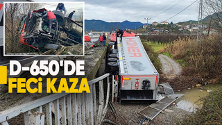 Tır bariyerleri aşarak devrildi