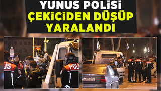 Yan yatan motoru tutmak isteyen polis düşerek yaralandı