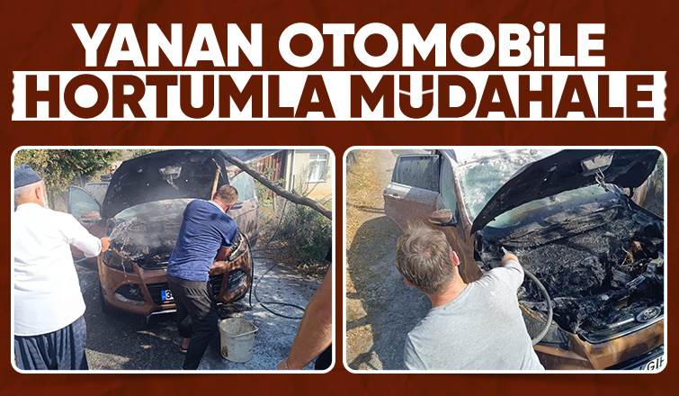 Yanan otomobili hortumla su tutarak söndürdüler