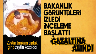 Zeytin tankına çıplak giren işçi